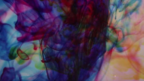 Color swirls of ink mixing together in water