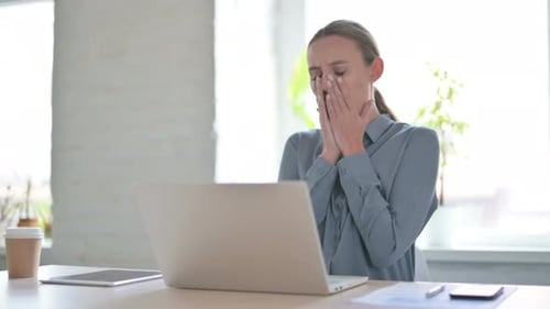 Woman Reacts to Laptop Negatively in Office Setting