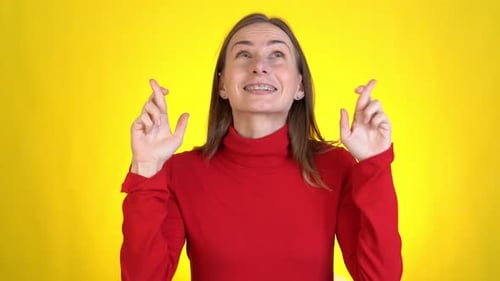 Hopeful Woman Crossing Fingers for Good Luck