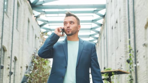 Young successful caucasian businessman works outdoor