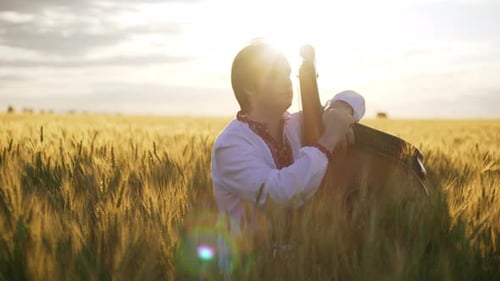 Slow Motion Young Bandurist Ukrainian Folk Musician Playing Bandura Pinch Strings on Traditional