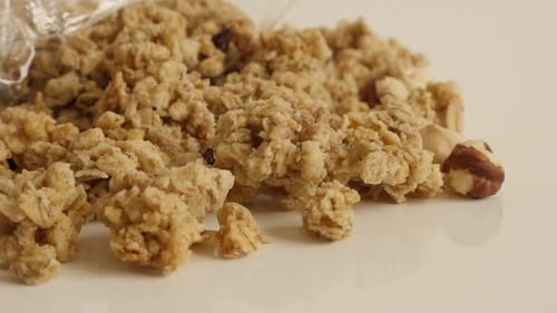 Tilting on organic breakfast with crunchy cereals 4K 2160p 30fps UltraHD footage - Sweet healthy mue