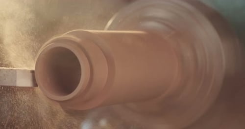 Woodworking Lathe Shaping Cylinder with Golden Lighting