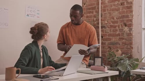 Diverse Colleagues Working Together in Office