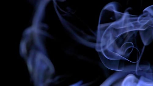 Abstract Blue Smoke Drifting on Black Background