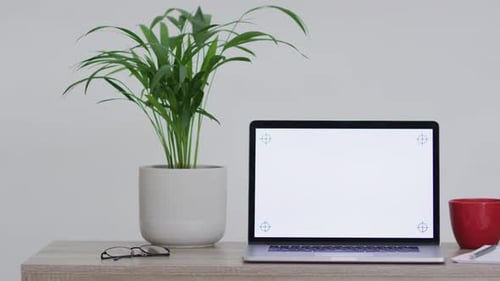 Animation of laptop on wooden table with copy space in office