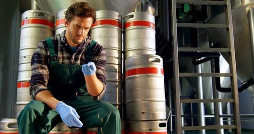 Brewer checking grains 4k