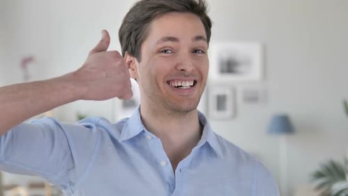 Happy Man Gives Thumbs Up Indoors