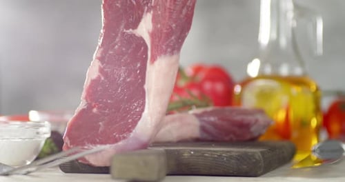 Preparing Fresh Raw Steak on Cutting Board