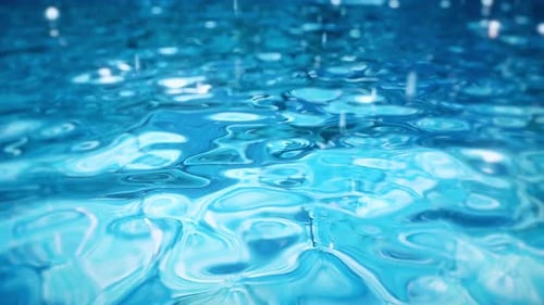 Pure Blue Water in the Pool with Light Reflections