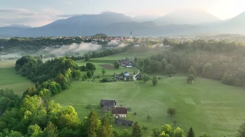 Flying over a river in mist on a beautiful sunrise