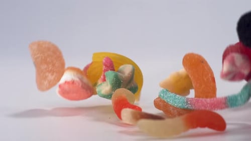 Colorful Gummy Candies Falling Into a Pile
