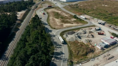 Aerial View of a Truck with a Trailer Leaving the Port