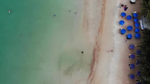 Sun Beds on Beach. Aerial View of Many Paired Sun Loungers with Umbrella on Deserted Beach