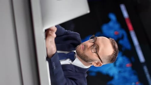 Man Works on Computer, Vertical Format