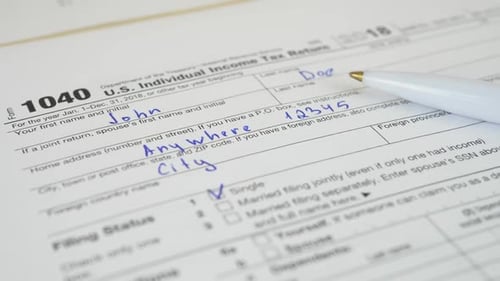 1040 Tax Form with Pen Close Up