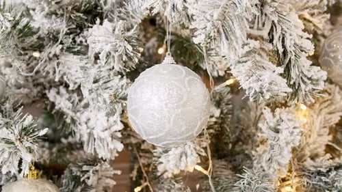 Christmas Tree with Snow Flocked Branches and Ornaments