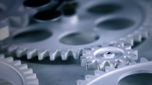 Mechanical Gears Rotating in Monochrome Cool Tones