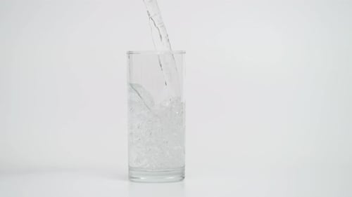 Water Being Poured Into Drinking Glass