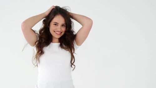 Happy Woman Posing with Hands in Hair