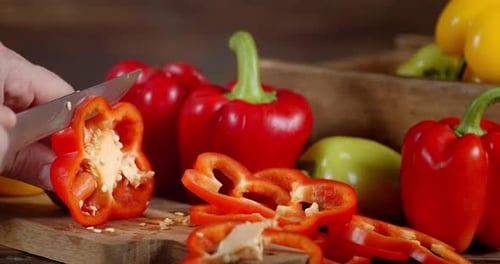 Hand Slicing Fresh Red Bell Pepper
