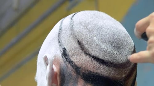 Scalp Design Being Painted onto Bald Head