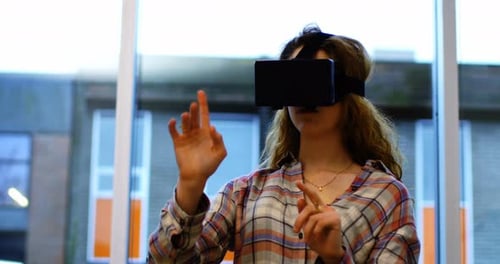 Woman Experiencing Virtual Reality Headset Indoors