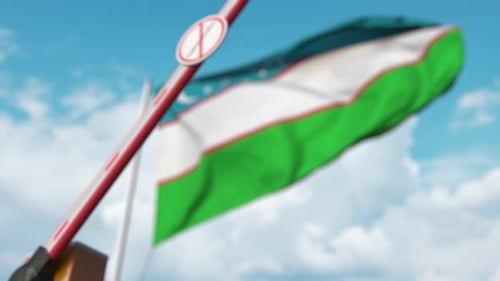 Uzbekistan Flag with Closing Barrier and Coronavirus Restriction Sign