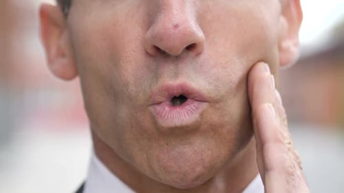 Man Touches Cheek, Mouth, Close Up