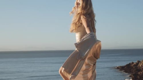 Dancing Woman In Dress On Sunny Beach
