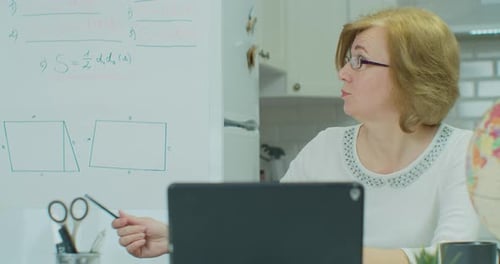 Teacher Explaining Math Online