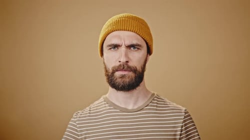 Man Shakes Head then Crosses Arms as No