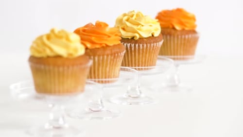 Delicious Cupcakes with Yellow and Orange Frosting