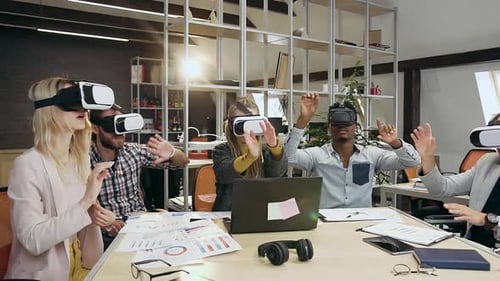 Team Immersed in Virtual Reality Experience at Work