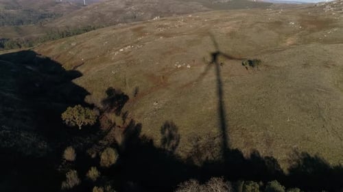 Wind Turbines Shadow, Renewable Energy on a Green Hill