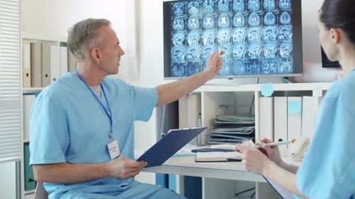 Diagnosticians Discussing X-ray Picture