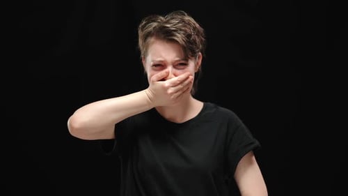 Young Woman Crying Covering Her Mouth