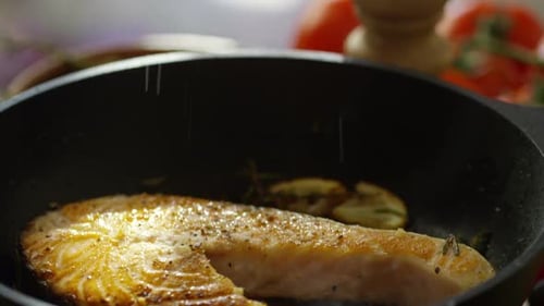 Sifting Salt on Fried Salmon