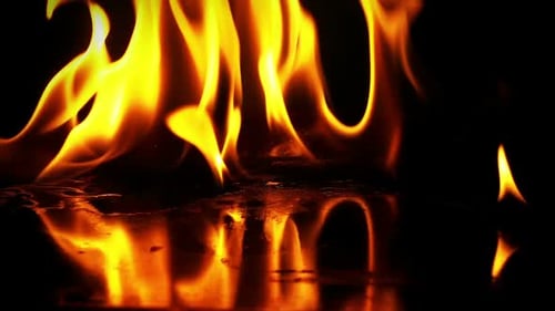 Intense Fire Flames Flickering on Dark Background