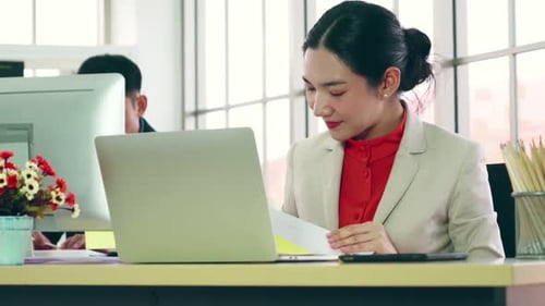 Business People Working at Table in Modern Office