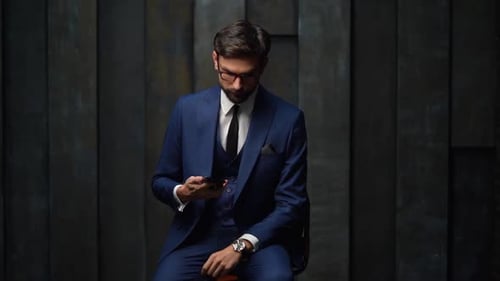 Man In Suit Answering Cell Phone Call