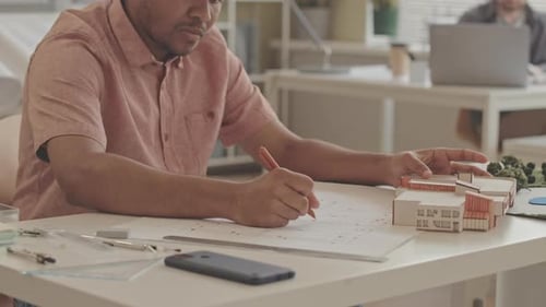 Biracial Architect Developing House Project in Office