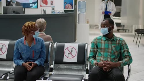 African American Patients with Face Mask Talking in Waiting Area