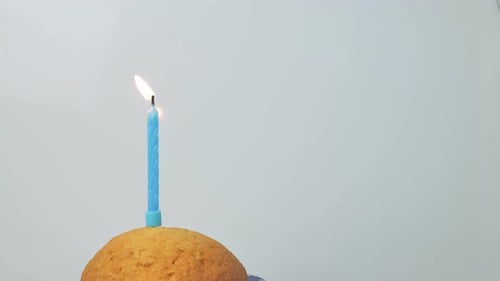 Cake with Burning Candle for Birthday Celebration