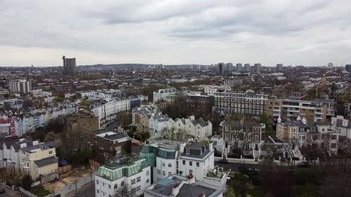 Aerial forward flight over the district of Notting Hill in London. Beautiful ancient buildings and r