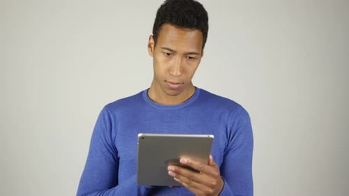 Man Using Tablet Device in Studio Setting