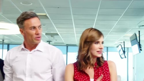 Business people giving a high five to each other in a modern office 4k