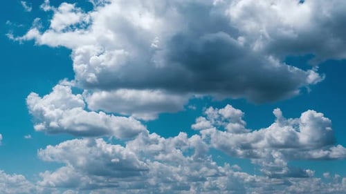 Blue Sky with Fluffy White Clouds Moving