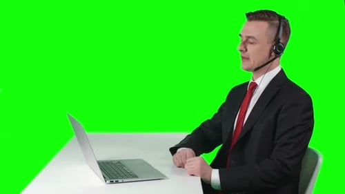 Man in Suit Doing Video Call on Laptop