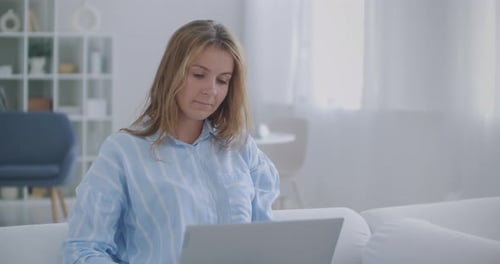 Young Woman Worker Relax Sit at Office Desk Finished Laptop Computer Work Put Hands Behind Head Feel